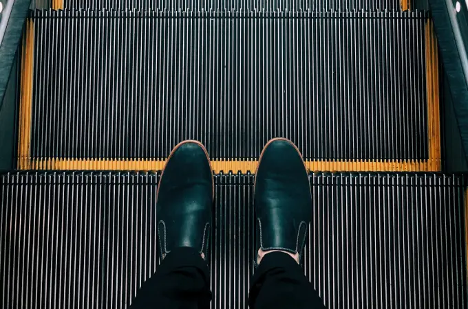 Person standing in an escalator